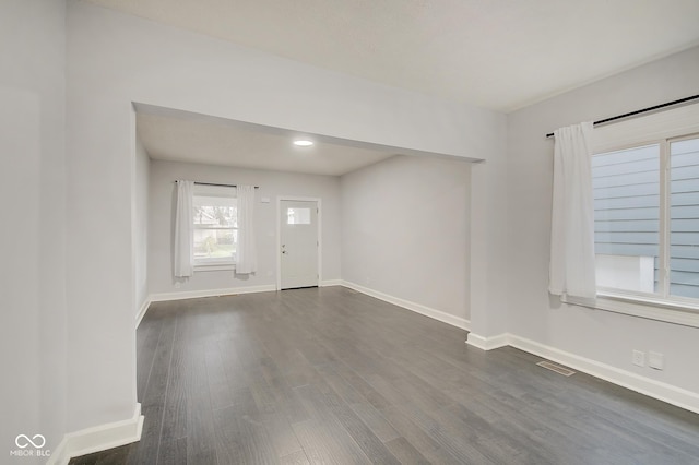 entrance foyer with dark hardwood / wood-style flooring