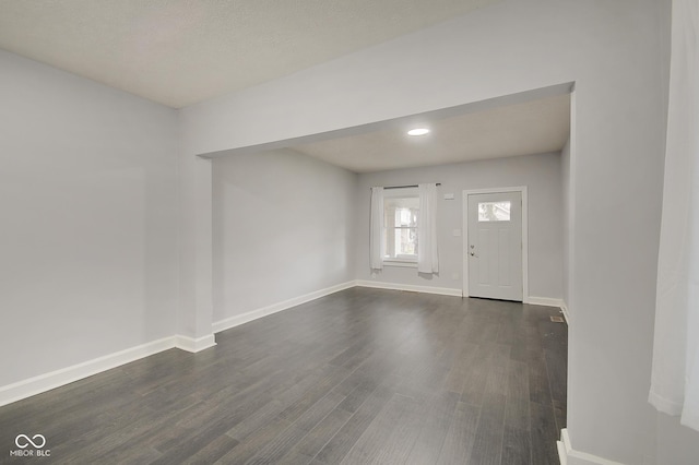 entryway with dark hardwood / wood-style floors