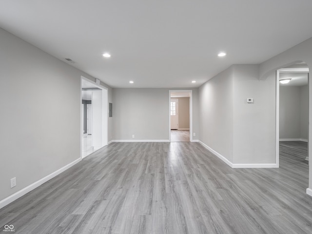 unfurnished room with light wood-type flooring