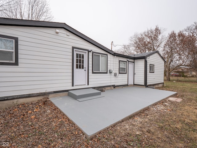 back of property with a patio area