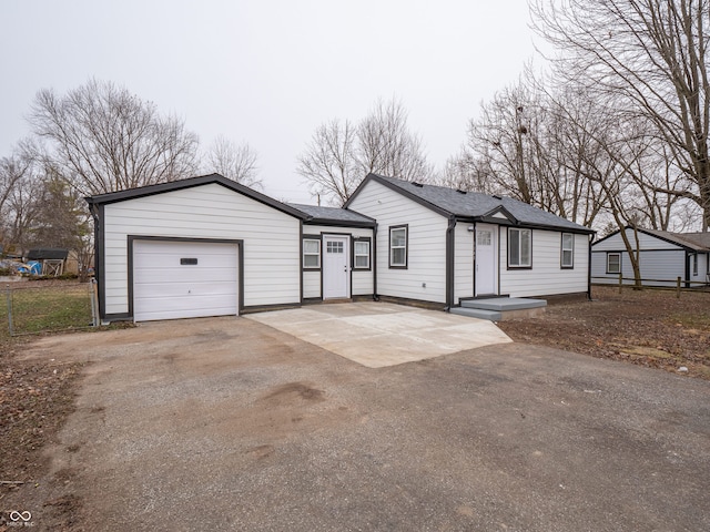 single story home featuring a garage