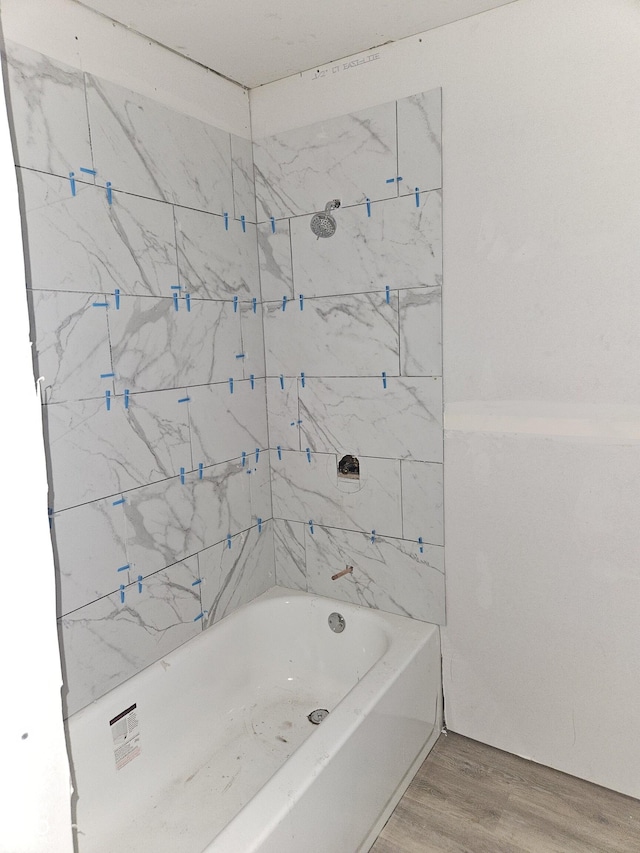 1207 W 35th St, Indianapolis, IN 46208 - bathroom with wood finished floors and shower / bathtub combination