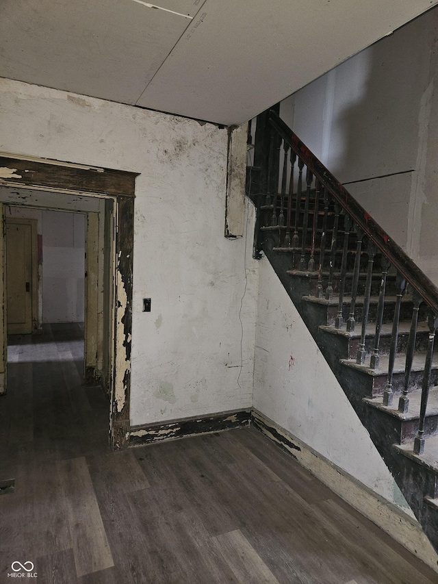 stairs with wood-type flooring