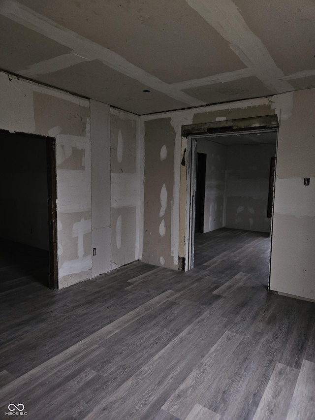 unfurnished room featuring hardwood / wood-style flooring