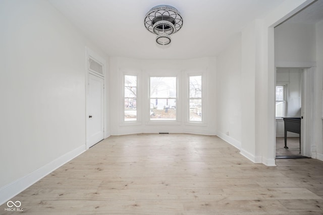 spare room with light wood-type flooring