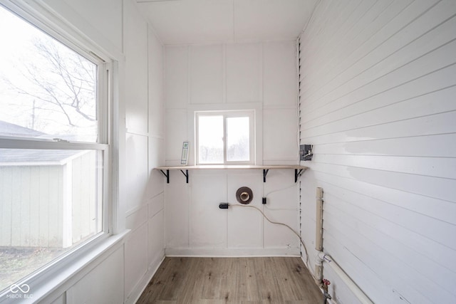 laundry room with light hardwood / wood-style floors