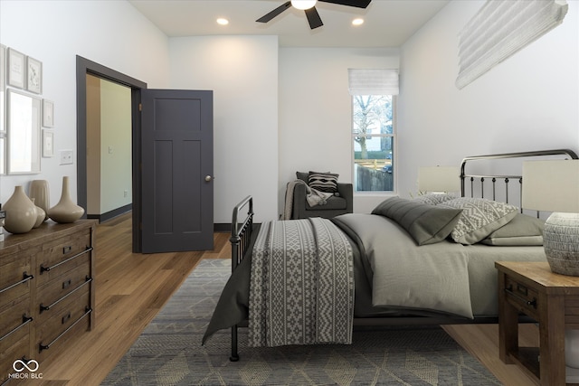 bedroom featuring ceiling fan and dark hardwood / wood-style floors