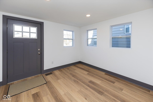 entrance foyer with light hardwood / wood-style flooring