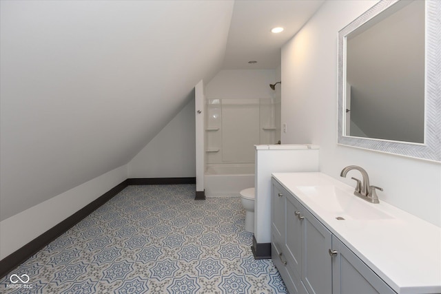 full bathroom with vanity,  shower combination, toilet, and vaulted ceiling