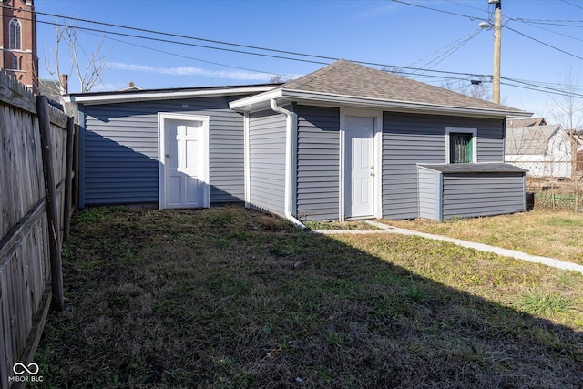 rear view of house with a lawn