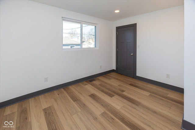 empty room featuring hardwood / wood-style flooring