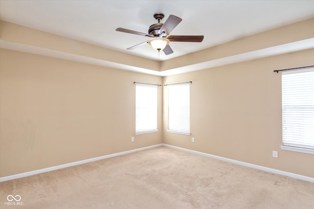 empty room with light carpet and ceiling fan