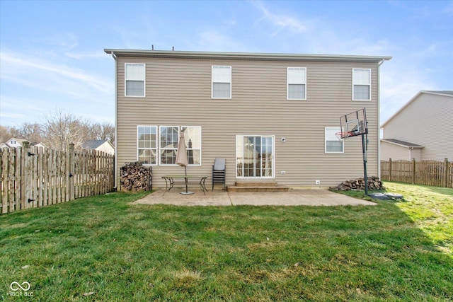 rear view of house featuring a lawn and a patio area