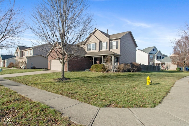 front facade with a front lawn and a garage