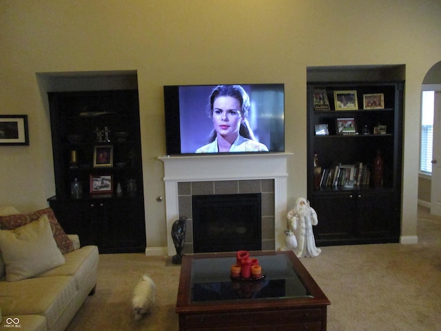 carpeted living room featuring a fireplace