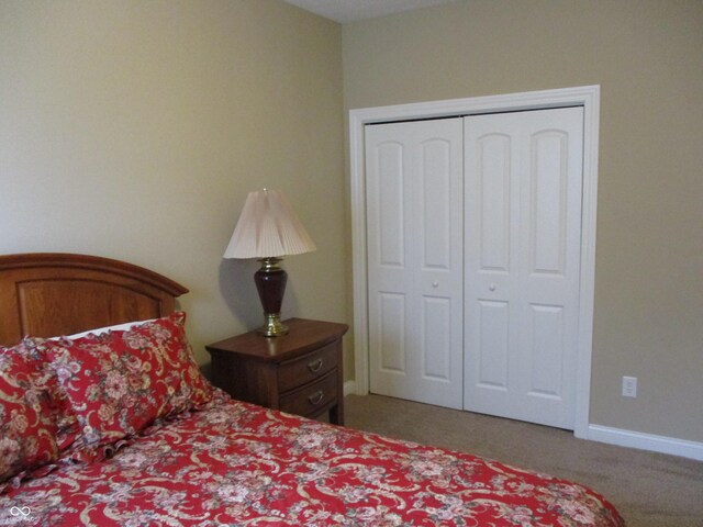 carpeted bedroom featuring a closet