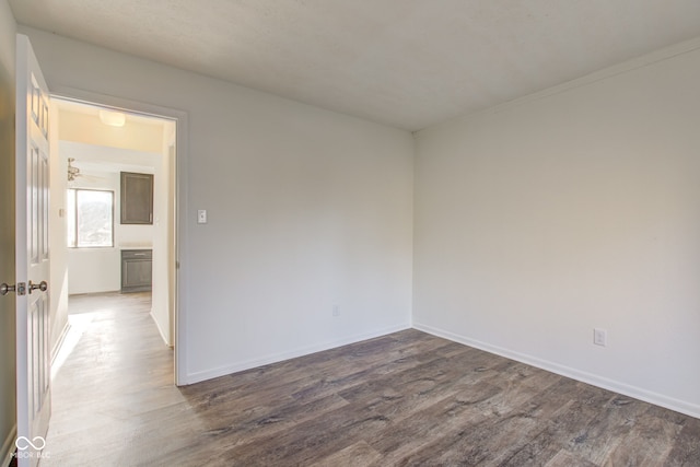 spare room featuring dark hardwood / wood-style flooring