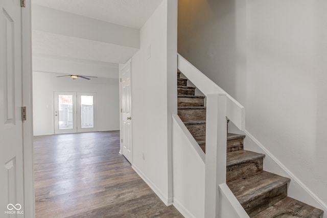 staircase with hardwood / wood-style flooring, ceiling fan, and french doors