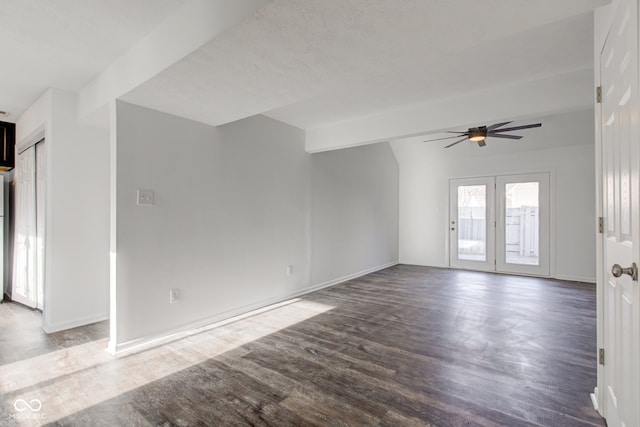 spare room featuring beam ceiling, ceiling fan, and hardwood / wood-style flooring