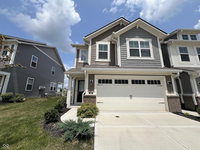 view of front of house featuring a garage and a front lawn