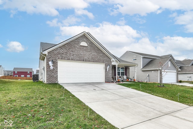 view of front of property with central AC unit, a garage, and a front lawn