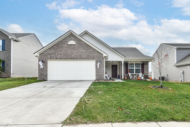 view of front of home featuring a front yard and a garage