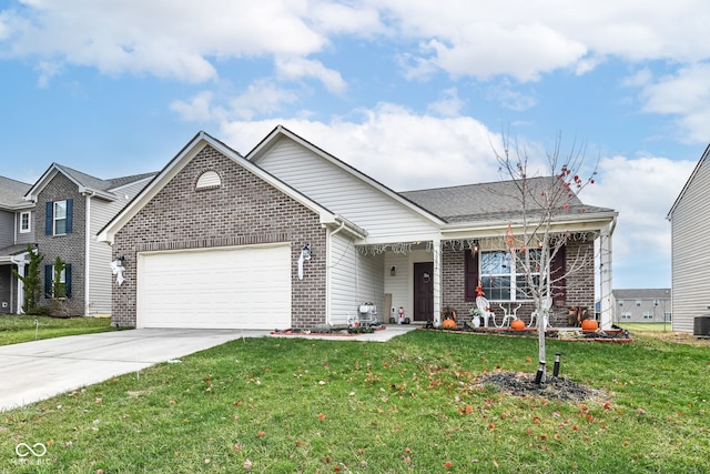 view of front of house with central AC unit, a garage, and a front yard