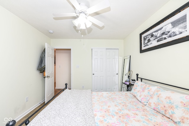 bedroom with a closet, ceiling fan, and dark hardwood / wood-style floors