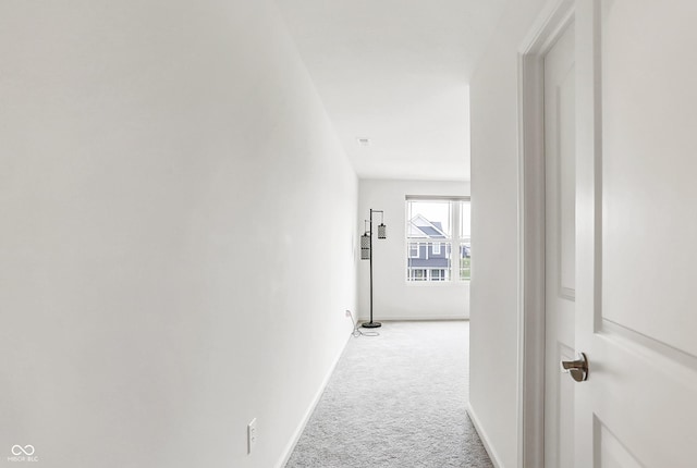 corridor with light colored carpet