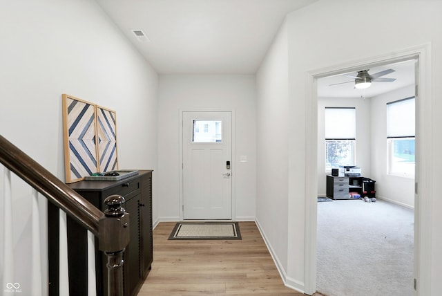 entryway featuring ceiling fan and light wood-type flooring