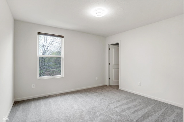 unfurnished room with carpet floors