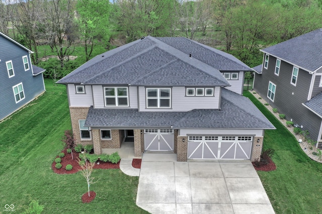 view of front of property with a garage and a front yard