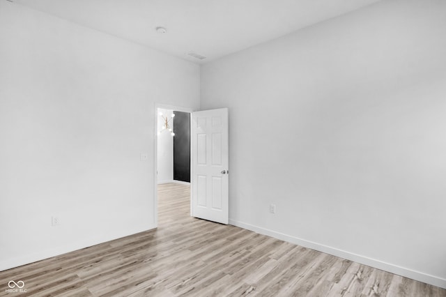 spare room featuring light hardwood / wood-style flooring