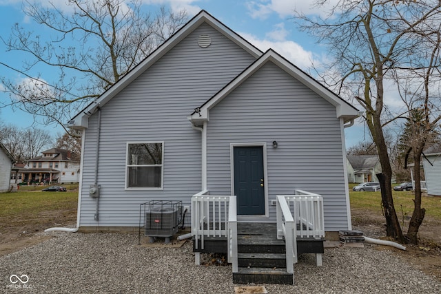 back of property with central AC