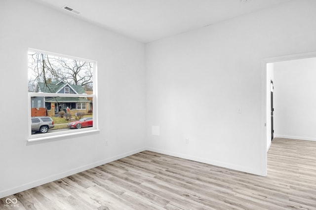 unfurnished room featuring light wood-type flooring