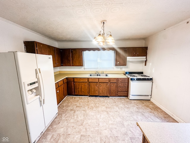 kitchen with white appliances, crown molding, sink, a notable chandelier, and hanging light fixtures