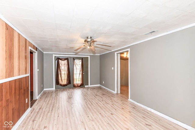 4925 W Raymond St, Indianapolis, IN 46241 - unfurnished room featuring wood finished floors, a ceiling fan, crown molding, and wooden walls