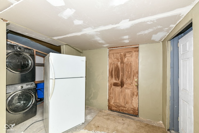 laundry area with stacked washing maching and dryer