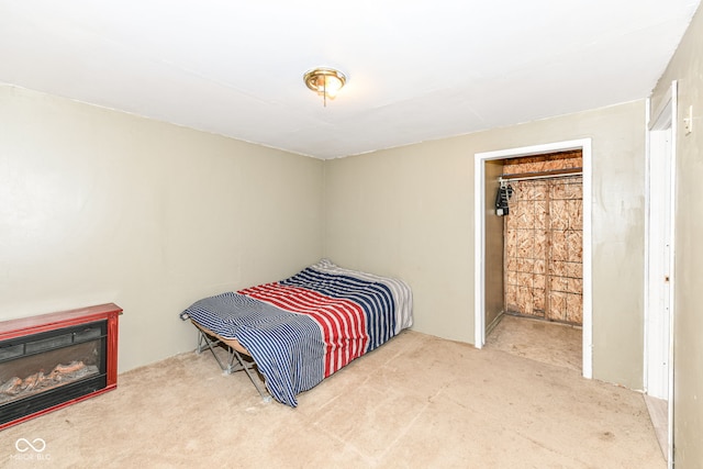 4925 W Raymond St, Indianapolis, IN 46241 - carpeted bedroom with a glass covered fireplace