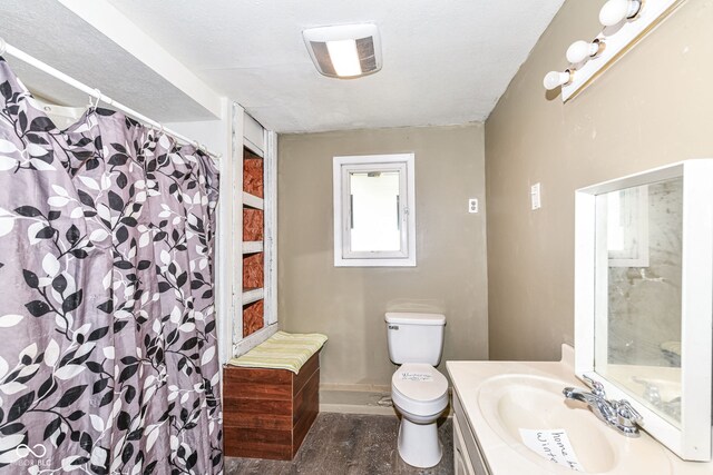 4925 W Raymond St, Indianapolis, IN 46241 - bathroom with vanity, wood finished floors, and curtained shower