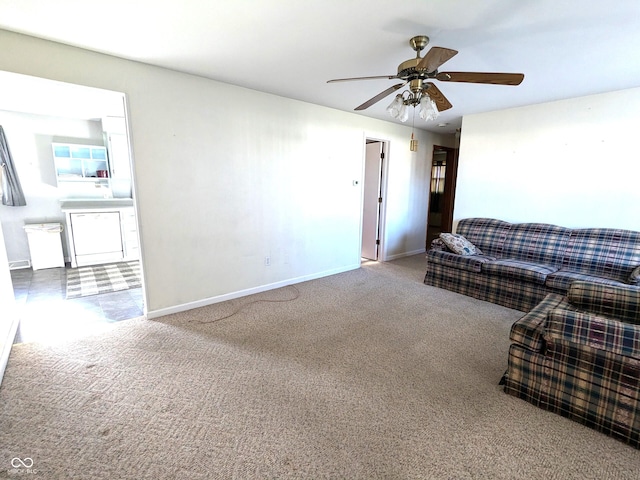 living room featuring carpet and ceiling fan