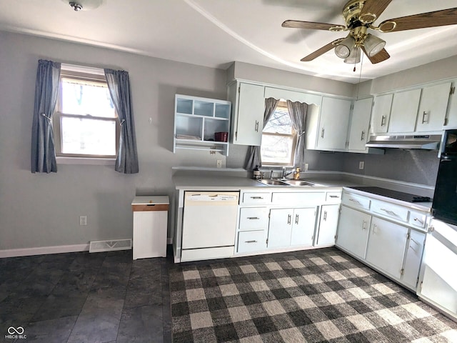 kitchen featuring cooktop, white cabinets, sink, and white dishwasher