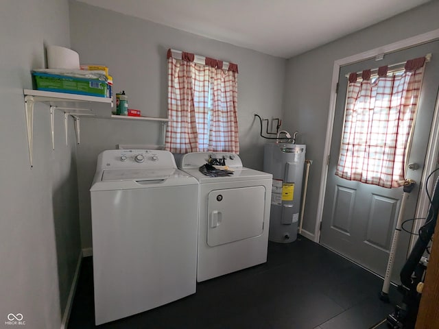 washroom featuring washer and clothes dryer and water heater