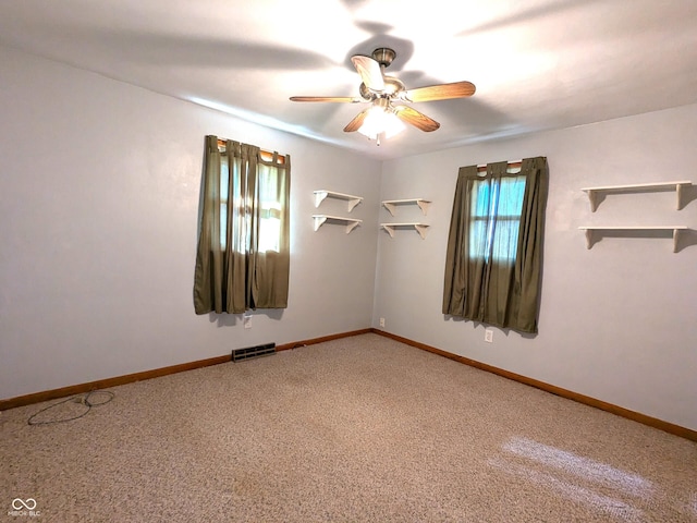 empty room featuring carpet and ceiling fan