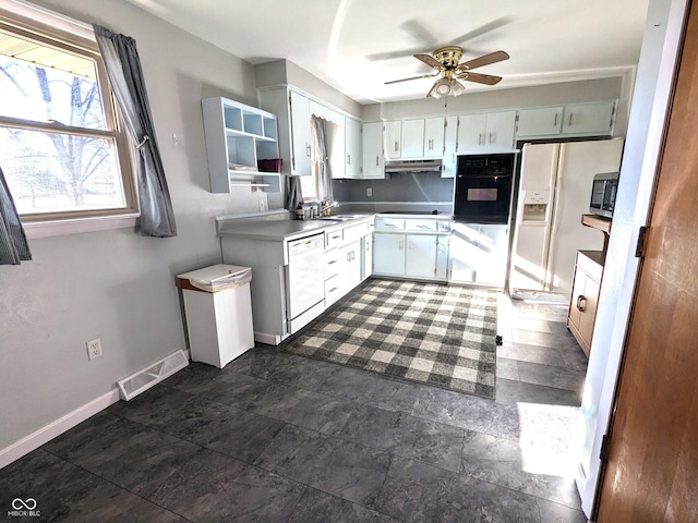 kitchen featuring sink, ceiling fan, and black appliances