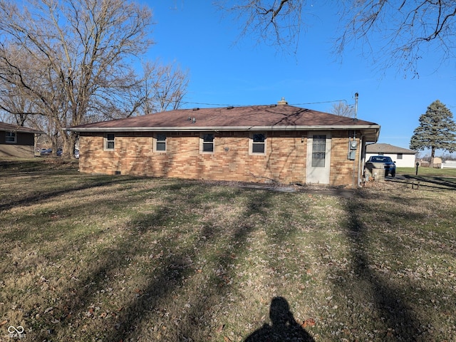 rear view of house with a lawn