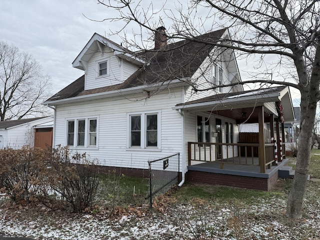 view of snowy exterior with a porch