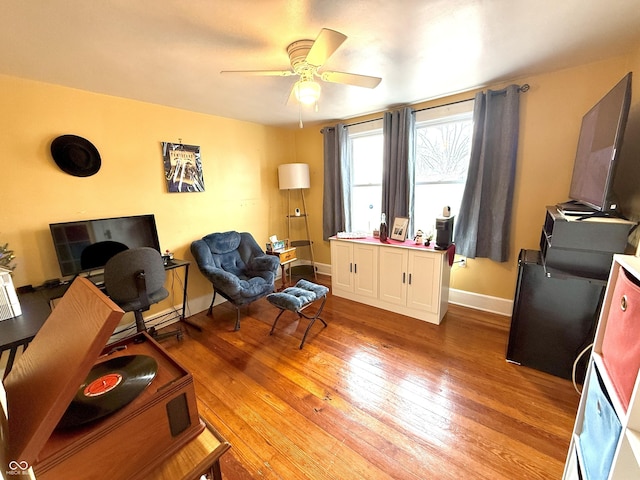 office area with ceiling fan and light hardwood / wood-style floors