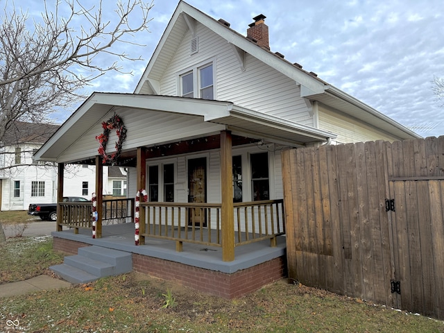 bungalow-style home with a porch