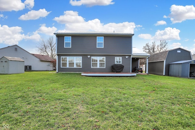 back of property with a yard and a shed